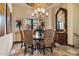 Elegant dining room featuring a round table, chandelier, and ornate furnishings at 10537 N Crestview Dr, Fountain Hills, AZ 85268