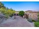 Brick driveway leading to a stone home with a three-car garage at 10537 N Crestview Dr, Fountain Hills, AZ 85268