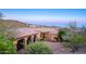 Stunning home with a paver driveway, lush landscaping, and stone accents create a grand entrance and beautiful curb appeal at 10537 N Crestview Dr, Fountain Hills, AZ 85268