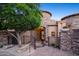 Beautiful stone home with a brick driveway and arched entrance at 10537 N Crestview Dr, Fountain Hills, AZ 85268