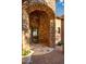 The front entrance features a custom iron door and stone archway at 10537 N Crestview Dr, Fountain Hills, AZ 85268