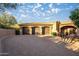 Expansive three-car garage with wooden doors and paver driveway provides ample parking and storage at 10537 N Crestview Dr, Fountain Hills, AZ 85268