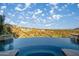 Stunning infinity pool with desert views, creating a serene and luxurious outdoor experience at 10537 N Crestview Dr, Fountain Hills, AZ 85268