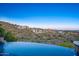 Gorgeous infinity pool overlooks scenic desert landscape with mountain views and luxury homes at 10537 N Crestview Dr, Fountain Hills, AZ 85268