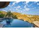 Infinity pool with desert views, creating a serene and luxurious outdoor experience at 10537 N Crestview Dr, Fountain Hills, AZ 85268