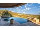 Stunning infinity pool with desert views, creating a serene and luxurious outdoor experience at 10537 N Crestview Dr, Fountain Hills, AZ 85268