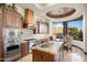 Chef's kitchen features stainless steel appliances, custom cabinetry, and a granite island at 10537 N Crestview Dr, Fountain Hills, AZ 85268