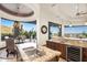 Gourmet kitchen with granite counters, custom cabinetry, stainless appliances, and breakfast nook at 10537 N Crestview Dr, Fountain Hills, AZ 85268