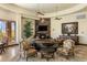 Open-concept living area with fireplace, elegant furnishings and recessed lighting at 10537 N Crestview Dr, Fountain Hills, AZ 85268