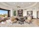Bright and airy living room featuring a stone fireplace, unique ceiling details, and elegant furnishings at 10537 N Crestview Dr, Fountain Hills, AZ 85268