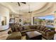Large living room with views of neighborhood, a fireplace and open kitchen access at 10537 N Crestview Dr, Fountain Hills, AZ 85268