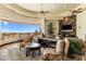 Spacious living room with stone fireplace, large windows and detailed furnishings at 10537 N Crestview Dr, Fountain Hills, AZ 85268