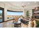 Well-appointed living room boasts scenic views, stone fireplace, and upscale décor at 10537 N Crestview Dr, Fountain Hills, AZ 85268