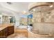The spacious main bath includes a walk-in shower, a soaking tub, and great natural light and views at 10537 N Crestview Dr, Fountain Hills, AZ 85268