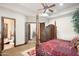 This bedroom features a four poster bed, ceiling fan, and ensuite bathroom at 10537 N Crestview Dr, Fountain Hills, AZ 85268
