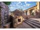 This backyard patio features a stone outdoor fireplace at 10537 N Crestview Dr, Fountain Hills, AZ 85268