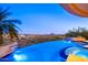 Tranquil patio features an infinity pool, spa, lush greenery, and breathtaking views, perfect for outdoor relaxation at 10537 N Crestview Dr, Fountain Hills, AZ 85268