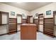 This large walk-in closet is complete with custom shelving and a center island for optimal storage at 10537 N Crestview Dr, Fountain Hills, AZ 85268