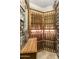 Custom wine cellar with stone walls, wooden racks, and ample storage space at 10537 N Crestview Dr, Fountain Hills, AZ 85268