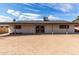 The backyard of the property features a covered patio and a spacious yard at 4729 W Orangewood Ave, Glendale, AZ 85301