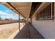 Spacious backyard featuring a covered patio with views of the backyard and brick fence at 4729 W Orangewood Ave, Glendale, AZ 85301