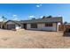 Charming single-story home featuring a gravel yard and a neutral-colored exterior under a bright blue sky at 4729 W Orangewood Ave, Glendale, AZ 85301