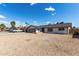 Charming single-story home with desert landscaping, gray garage door and white brick at 4729 W Orangewood Ave, Glendale, AZ 85301