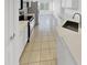 Well-lit kitchen with stainless steel appliances and tile flooring at 16186 W Silver Falls Dr, Surprise, AZ 85374
