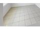 Neutral-toned tile flooring in a naturally lit living room area at 16186 W Silver Falls Dr, Surprise, AZ 85374