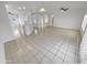 Open-concept living area with tile flooring and ample natural light at 16186 W Silver Falls Dr, Surprise, AZ 85374