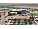 Aerial view of a modern clubhouse under construction near a lake at 1276 S Golden Ore Pass, Apache Junction, AZ 85120