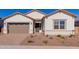 Single-story home with two-car garage and desert landscaping at 16380 W Avenida Del Sol --, Surprise, AZ 85387