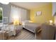Cozy bedroom with neutral tones, a comfortable bed, and natural light from a window at 11322 W Diana Ave, Peoria, AZ 85345