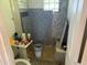 Interior shot of a dirty bathroom with tile surround and a pedestal sink at 1535 E Christy Dr, Phoenix, AZ 85020