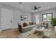 Bright living room with a comfortable sofa, stylish decor, and plenty of natural light at 26615 S 181St Pl, Queen Creek, AZ 85142