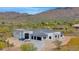 Stunning aerial view of a modern home with a detached garage, showcasing a desirable location at 6501 E Willow Springs N Ln, Cave Creek, AZ 85331