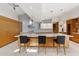 Stylish kitchen featuring an island with seating, sleek countertops, and modern appliances at 8517 N 48Th Pl, Paradise Valley, AZ 85253