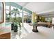 Expansive living room featuring seamless indoor-outdoor flow with views of the pool and desert landscape at 8517 N 48Th Pl, Paradise Valley, AZ 85253