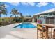 Backyard pool with ample patio space, palm trees, and modern architecture, perfect for entertaining at 8517 N 48Th Pl, Paradise Valley, AZ 85253