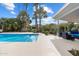 Backyard pool offers a refreshing oasis with a covered patio and desert landscaping at 8517 N 48Th Pl, Paradise Valley, AZ 85253