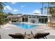 An outdoor living space with a refreshing pool and a view of the mountains in the background at 8517 N 48Th Pl, Paradise Valley, AZ 85253