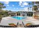 A backyard features a sparkling swimming pool and inviting lounge chairs for relaxation at 8517 N 48Th Pl, Paradise Valley, AZ 85253