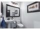 Bathroom with pedestal sink, toilet and mirror at 31221 N 161St Pl, Scottsdale, AZ 85262