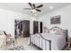 Bright bedroom with a metal bed frame and walk-in closet at 31221 N 161St Pl, Scottsdale, AZ 85262