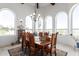 Bright dining room with large windows and wooden table at 31221 N 161St Pl, Scottsdale, AZ 85262