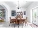 Bright dining room with wooden table and access to patio at 31221 N 161St Pl, Scottsdale, AZ 85262