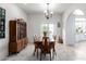 Charming dining room with wooden table and access to kitchen at 31221 N 161St Pl, Scottsdale, AZ 85262