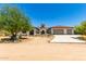 Spanish-style home with a large driveway and mature trees at 31221 N 161St Pl, Scottsdale, AZ 85262