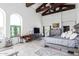 Large main bedroom with high ceilings, wood beams, and ensuite bathroom at 31221 N 161St Pl, Scottsdale, AZ 85262