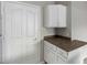 White kitchen cabinets with dark countertops at 16013 S Desert Foothills Pkwy # 1136, Phoenix, AZ 85048